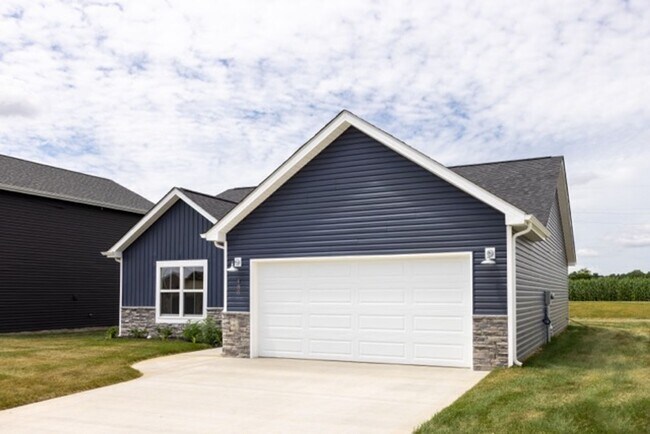 Building Photo - Modern Living Redefined with Stone Fireplace, Gray Cabinetry, Spa Inspired Primary Suite and Cove...