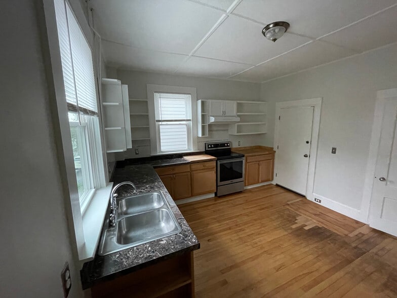 Kitchen w/ stainless steel appliances. - 18 North St
