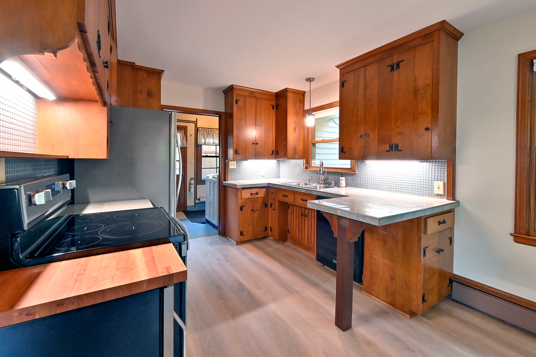 Kitchen with view into mud room/laundry room - 330 Central Ave S