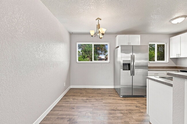 Building Photo - $2,095.95, 4 bed, 2 bath, located in Colorado Springs with a fenced-in backyard.