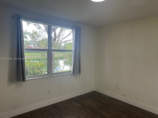 Building Photo - 3390 NE 13th Cir Dr