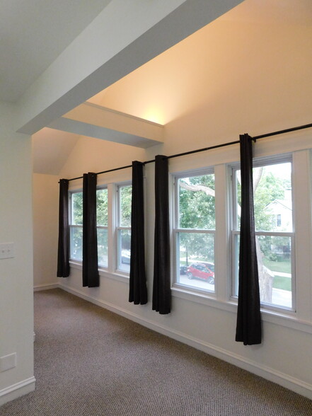 Main bedroom. Has nook outside main bathroom for storage or a small desk. - 1566 Dewey Ave