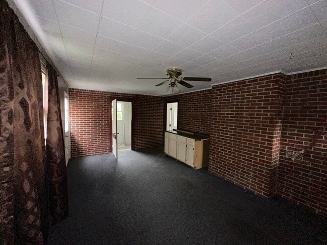 Building Photo - ONE LEVEL BRICK RANCHER WITH EXTRA LARGE LOT