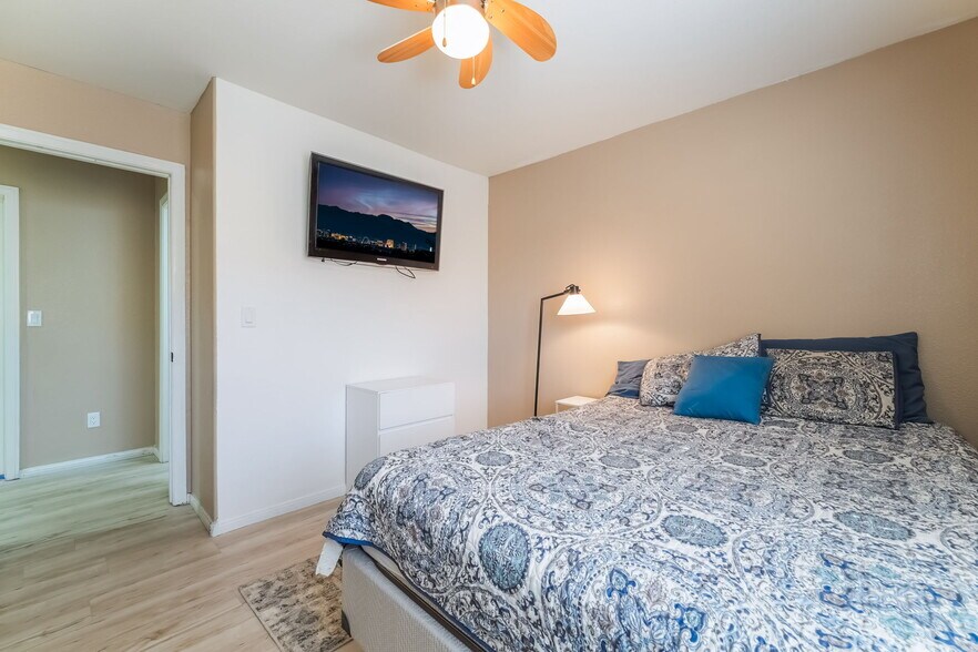 Bedroom featuring light wood-style flooring and ceiling fan - 1179 Antoinette St