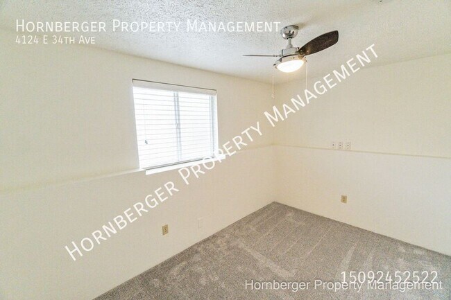 Building Photo - 4124 E 34th Ave