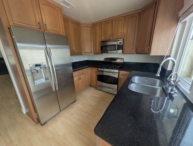 Building Photo - MOVE-IN READY - SPACIOUS 2-BEDROOM TOWNHOM...