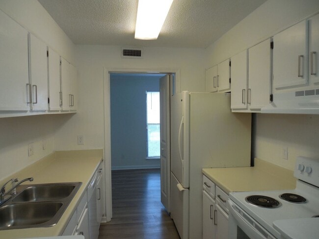 Building Photo - End Unit Condo Available now