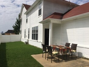 Building Photo - RARE HUGE fenced yard. Pets are allowed.