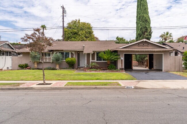Building Photo - Charming Updated Home With Drive-Through Garage Access