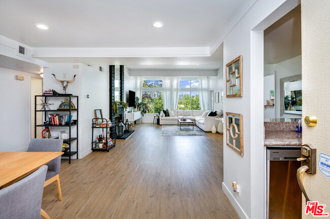 Main living area with 12 foot high ceilings /hard wood floors and LED lighting - 7800 Topanga Canyon Blvd