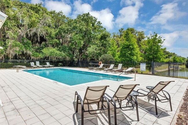 Building Photo - Water Front Home- 4 Large Bedrooms-3 baths Gated Community Call Sheila Campbell 407-687-7900