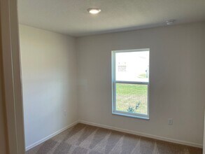 Building Photo - Like new 5/3/2 with screened in porch and much more...