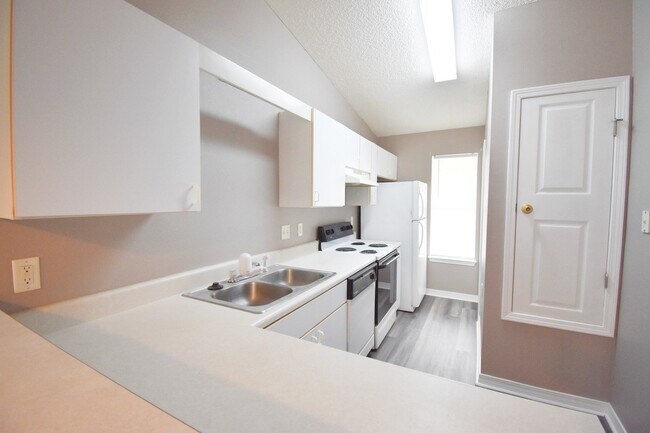 Building Photo - 2BR Patio Home with Open Layout, LVP Flooring, Private Fenced Yard, HOA Lawn Care & Convenient Bl...
