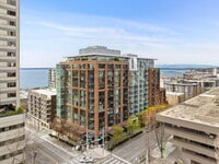 Building Photo - Open 2bdrm 1 bath with floor to ceiling windows!