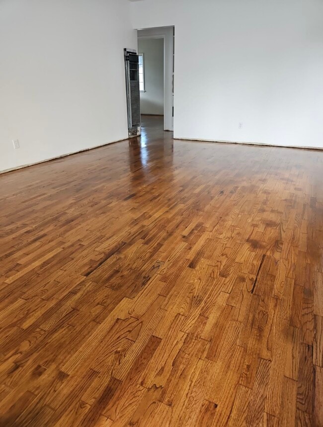 Living room refinished floors 10/2/23 - 14421 Kingsdale Ave