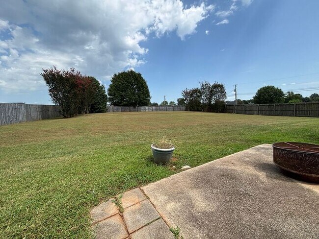 Building Photo - You will LOVE the fenced yard!