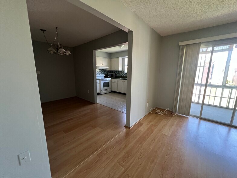 Living room looking toward dining room and kitchen in background - 3535 41st Ter S
