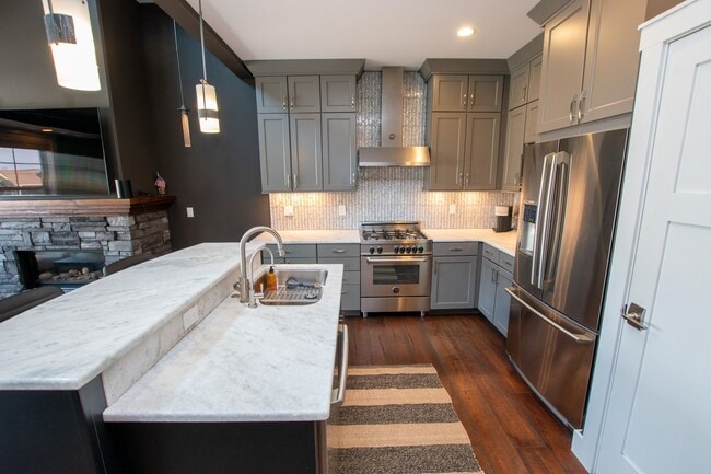 Building Photo - Experience Elevated Living with West Bay V...