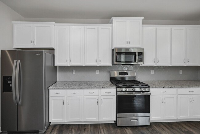Building Photo - Sophisticated Like-New 4-Bedroom Home with Designer Finishes & Fenced Backyard!