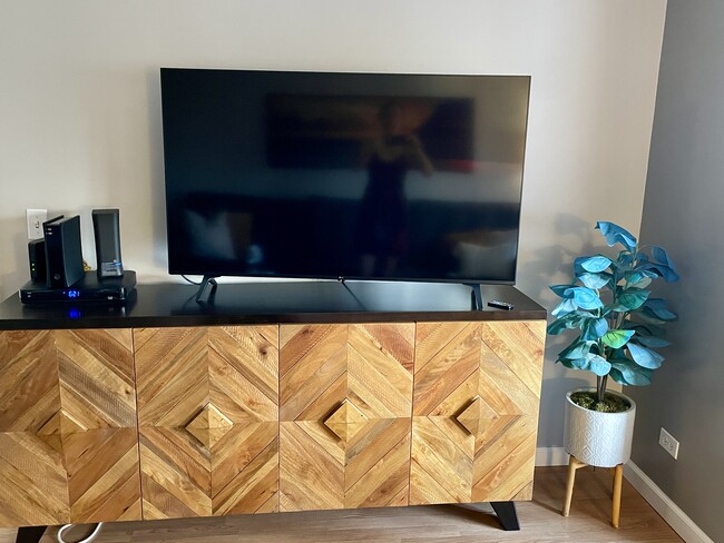 55” LG TV and sideboard. - 1521 Alexander St