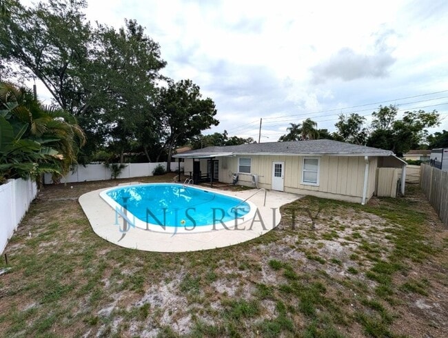 Building Photo - Just Reduced!!  POOL!! Beautiful 4/2/2 home with a POOL, 1700 Sq. Ft. with fenced yard, TONS of r...