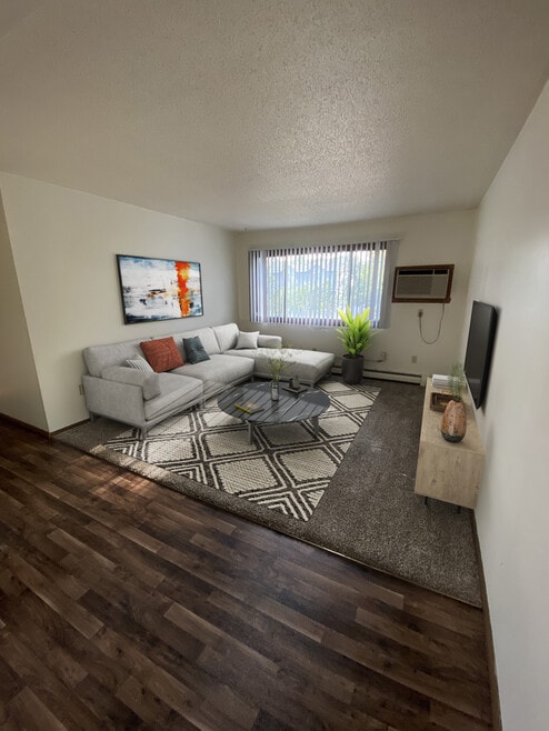 Updated 2 Bedroom University Park Living Room - Silver Leaf Apartments (North Fargo)