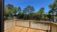 Building Photo - SPECTACULAR WATER-VIEW W/ LARGE DECK NEWER  MOBILE HOME