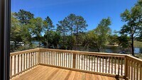 Building Photo - SPECTACULAR WATER-VIEW W/ LARGE DECK BRAND...