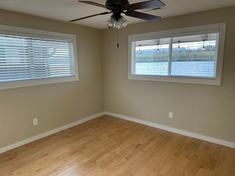 A ceiling fan will keep you comfortable, though the house has forced air heat and AC - 1879 N Jantzen Ave