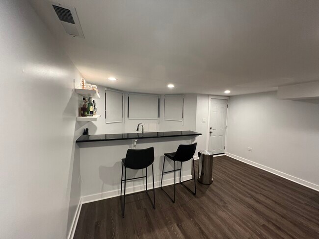 Ground level wet bar - 6033 S Eberhart Ave
