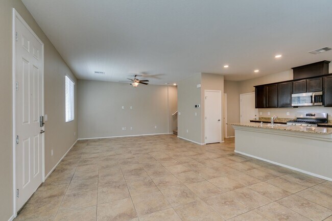 Building Photo - Spacious Townhouse with Loft & Rare 3-Car Garage!