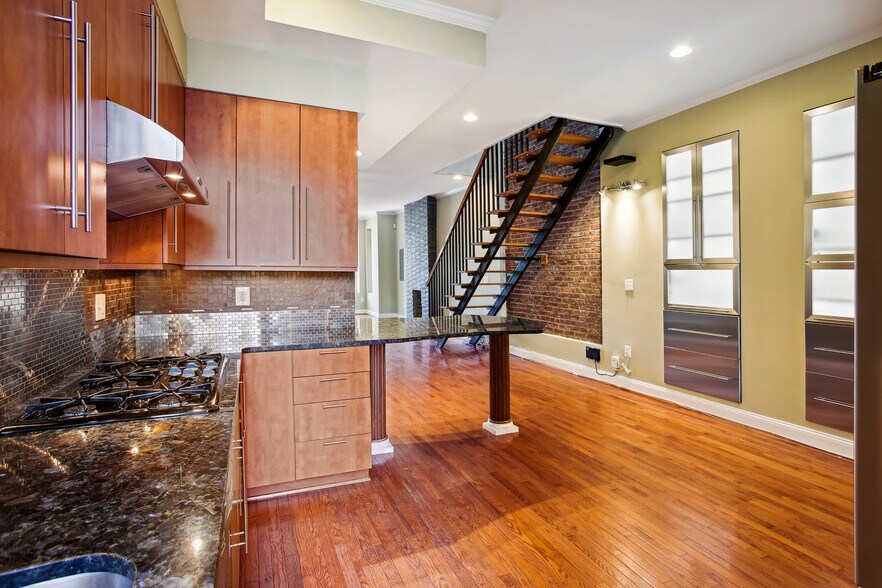 Gourmet kitchen with floating staircase - 76 R St NW