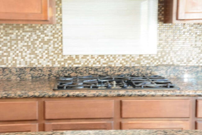 Building Photo - "Spacious 4-Bedroom Oasis with Granite Touches and Cozy Fireplace in Las Vegas!"