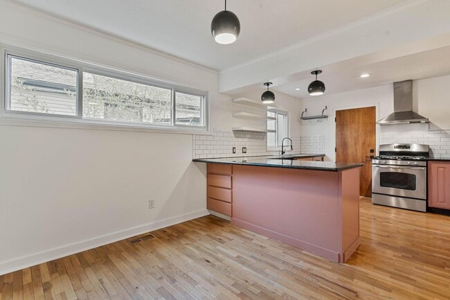 Building Photo - Beautiful, modern 4-bdrm/2-bath home in Concordia—Private, urban sanctuary w/ flex spaces