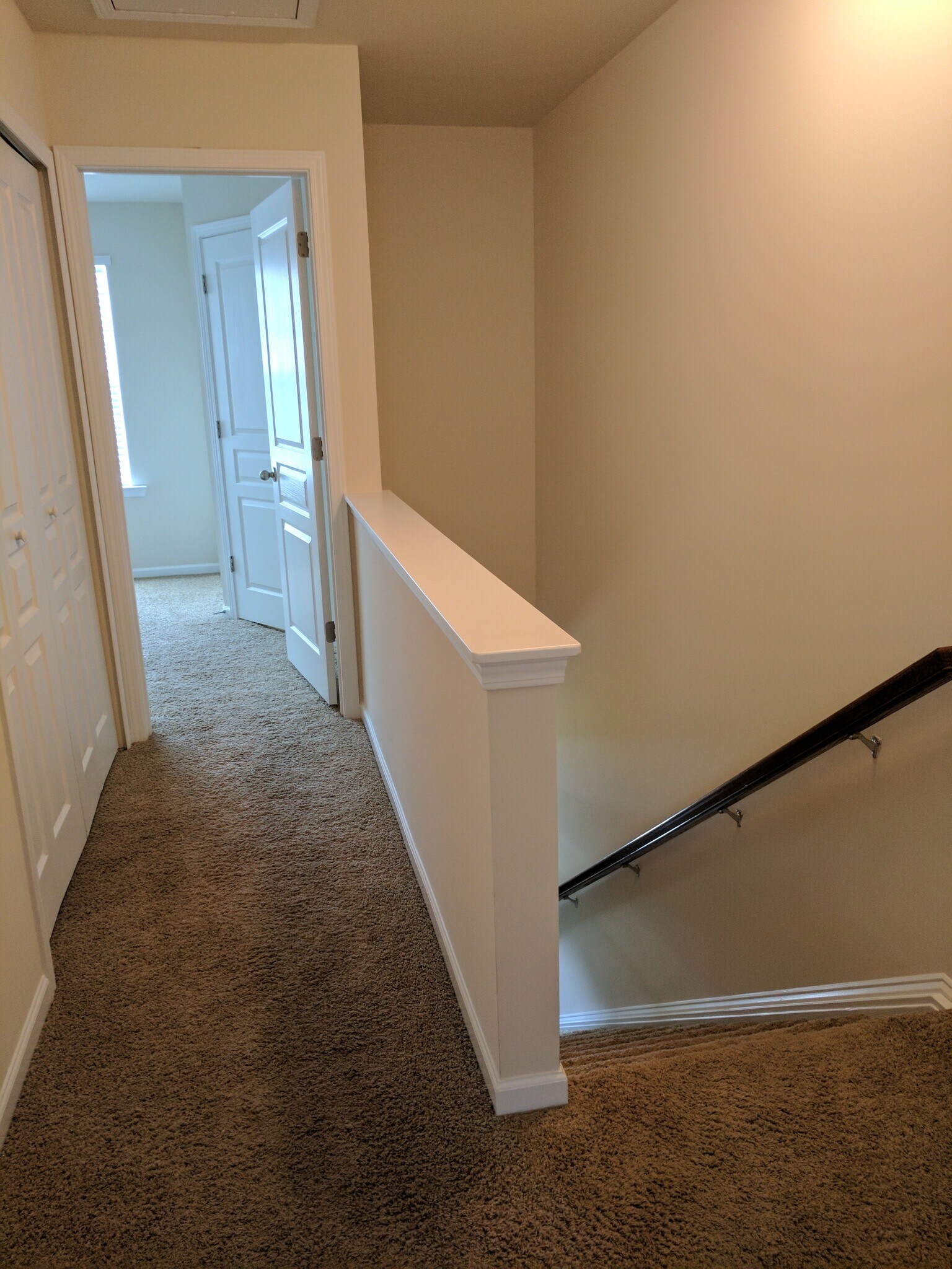 Upstairs hallway leading to bedroom #2 - 205 Spring Gardens Drive