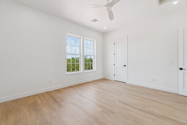 Building Photo - Bright. Clean. Calm. Your Elevated One-Bed...