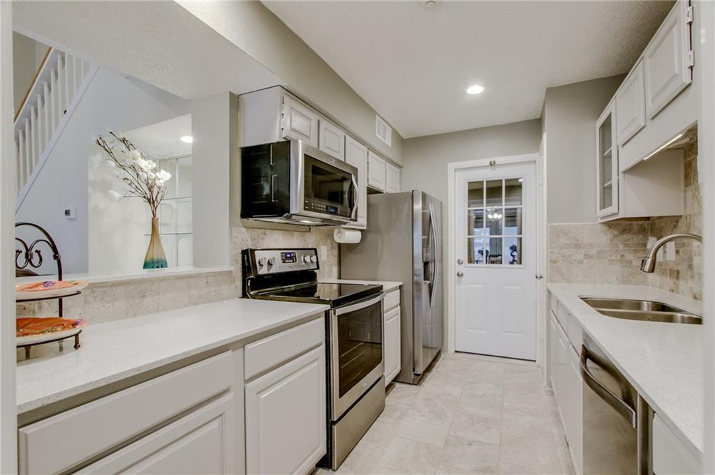 Kitchen refrigerator microwave and range - 631 Cimarron Trl