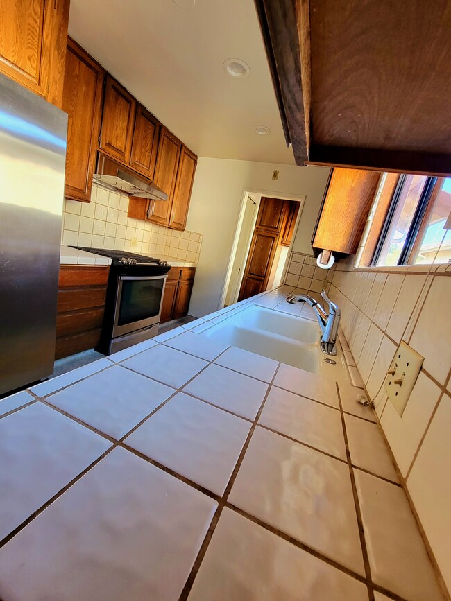 KITCHEN counter with multiple electrical sockets above counter - 12051 Alberta Dr