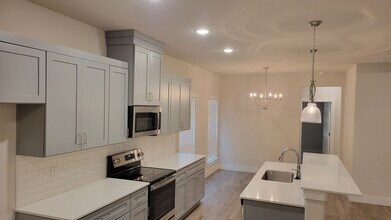 Building Photo - 3/2/2 CUSTOM FEATURES - OPEN CONCEPT - GOD...
