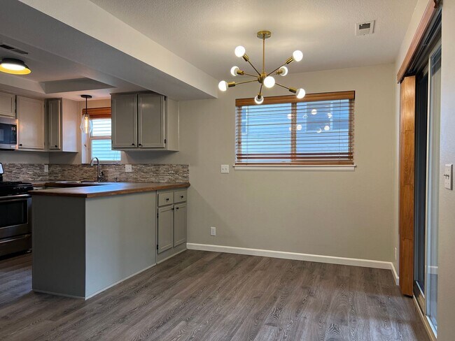 Building Photo - Water/Sewer/Garbage and landscaping included! A/C too!