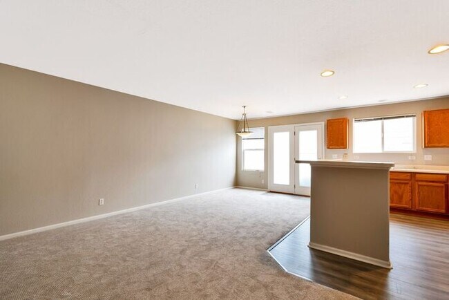 Building Photo - 3BR Townhome Near DIA & Light Rail | New Carpet, Garage & Fenced Patio