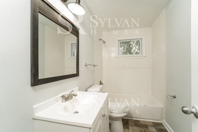 Building Photo - The living is easy in this 4 bedroom, 2 bathroom townhome