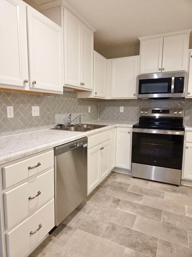 Building Photo - Exquisite just built condo with everything! Ground floor, no stairs, attached garage