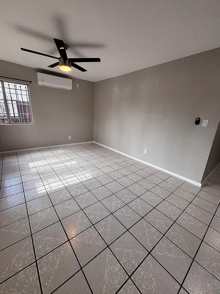 Bright and spacious living area with fresh paint and updated finishes throughout - 131 E 82nd Pl