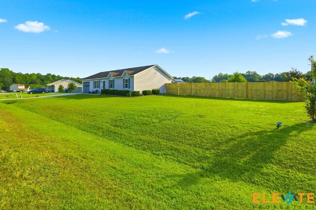 Building Photo - Beautiful Like-New 3 Bedroom Home with Huge Fenced Yard, Greenhouse & Storage