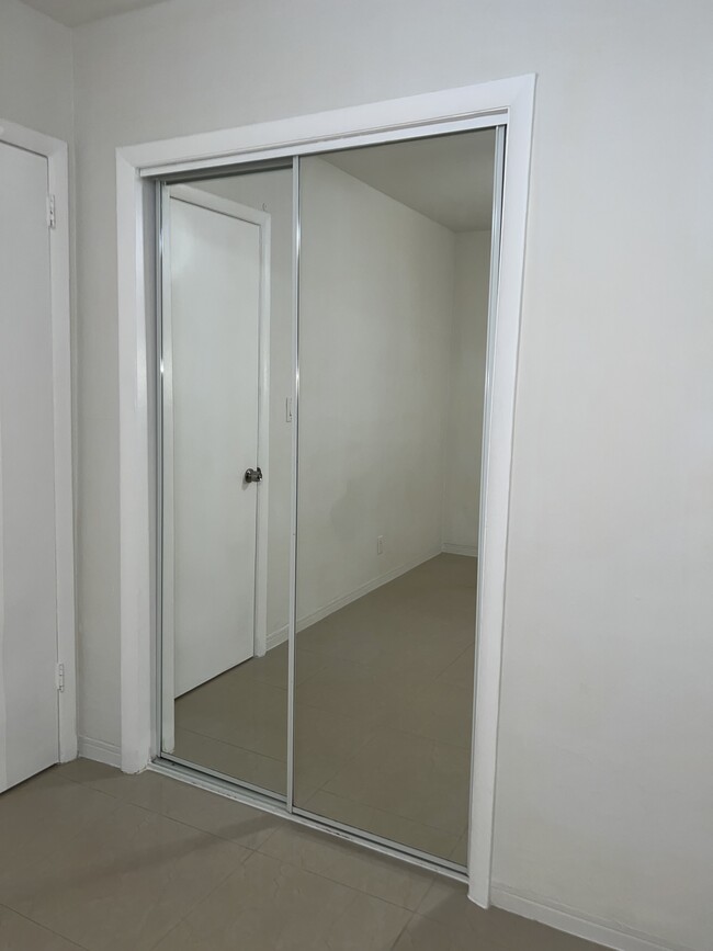 Bedroom closet with mirrors - 5010 SW 26th Ave