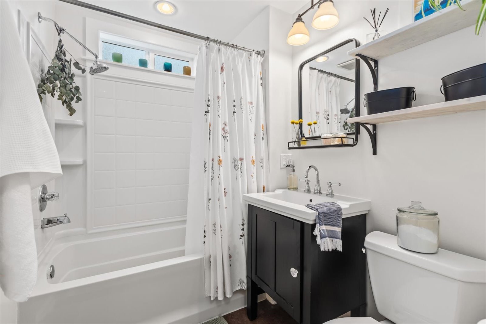 Bathroom with storage vanity and shelving - 8042 Earl Ave NW
