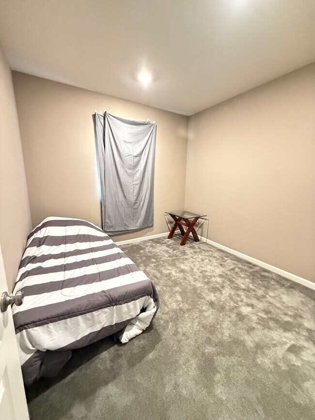 Building Photo - Spacious 5-Bedroom Home | Private Yard + Attached Garage