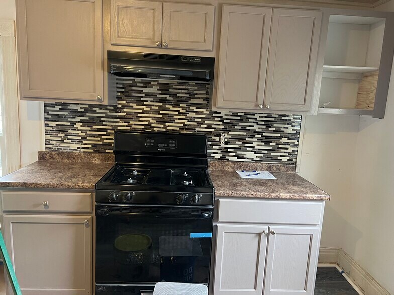 Brand new kitchen with black appliances. - 206 Tompkins St