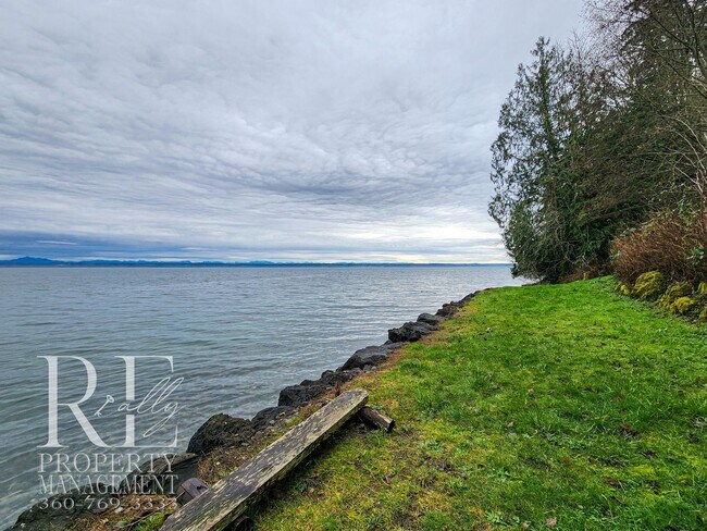 Building Photo - MOVE-IN SPECIAL: 50% OFF FIRST MONTHS RENT - Waterfront Rustic Retreat with Vaulted Ceilings, Pic...